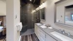 En suite bathroom with double sink vanity